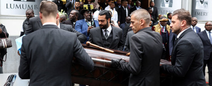 The coffin of Democratic Republic of Congo's first prime minister and independence hero Patrice Lumumba is carried away after a tribute ceremony at The Congolese Embassy before the departure of his last remains to DR Congo in Brussels on 21 June 2022. Picture: Kenzo TRIBOUILLARD/AFP