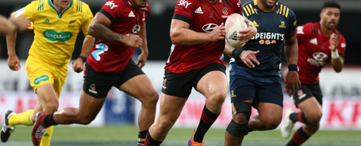 The Crusaders' Brodie McAlister runs the ball into Highlanders territory during their Super Rugby Aotearoa match in Dunedin on 26 February 2021. Picture: AFP