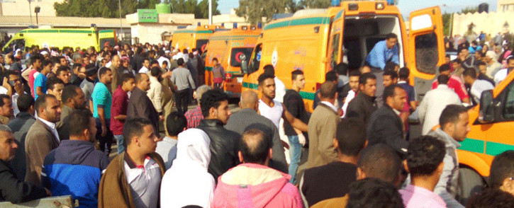 Egyptians gather around ambulances following a gun and bombing attack on the Rawda mosque near the North Sinai provincial capital of El-Arish on 24 November 2017. Picture: AFP