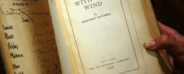 In this file photo a copy of the book "Gone With the Wind" by Margaret Mitchell, signed by producer, director, and most of speaking cast of the 1939 Hollywood film, is pictured 18 October 2007 in Los Angeles. Picture: AFP