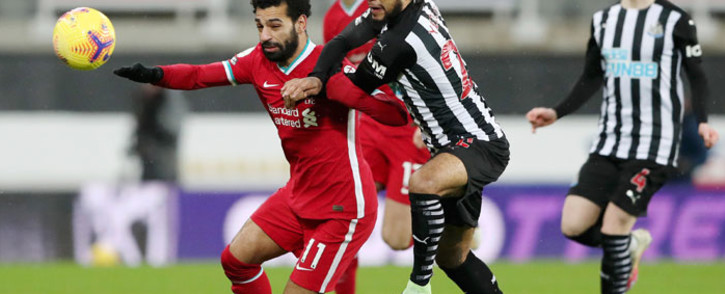 Liverpool's Mohammed Salah attempts to hold off a Newcastle defender during their English Premier League match on 30 December 2020. Picture: @LFC/Twitter