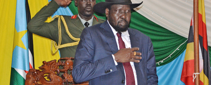 FILE: South Sudan's President Salva Kiir stands for South Sudan's national anthem before signing a peace agreement in the capital Juba, on 26 August, 2015. Picture: AFP.