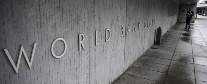 FILE: A person walks by the building of the Washington-based global development lender, The World Bank Group, in Washington on 17 January 2019. Picture: Eric BARADAT/AFP