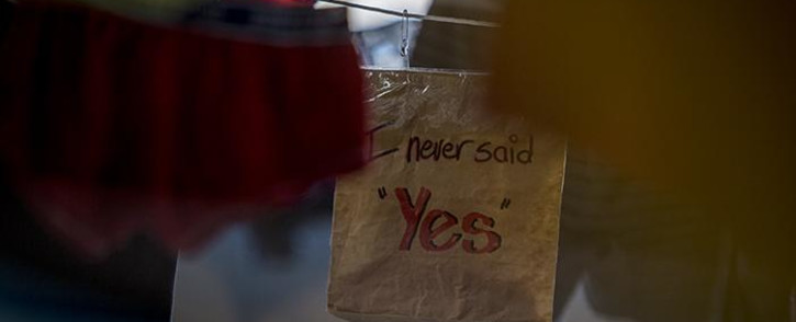 A paper bag with the words "I never said yes" written on it was pegged up between some of the 3600 pairs of underwear hung up in Maboneng as part of the "Airing SA's dirty laundry" exhibition in Johannesburg. Picture: Reinart Toerien/EWN.