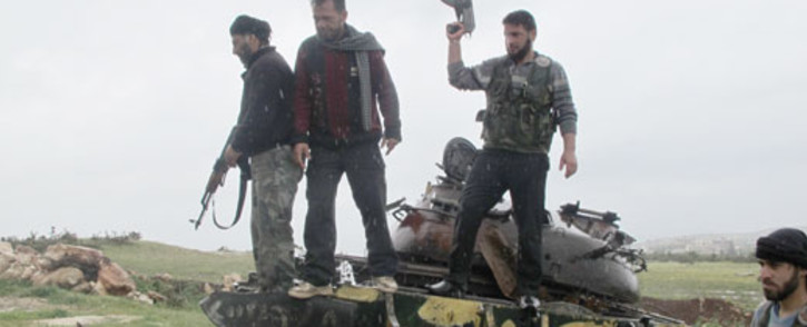 FILE: A group of rebels on a tank in Darkoush, Syria. Picture: Rahima Essop/EWN.