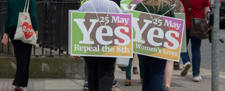 Activists from the 'Yes' campaign, urging people to vote 'yes' in the referendum to repeal the eighth amendment of the Irish constitution, canvas voters in Dublin on 24 May 2018. Picture: AFP