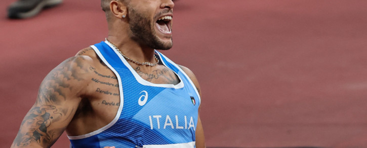 Italy's Lamont Marcell Jacobs celebrates after winning the men's 100m final during the Tokyo 2020 Olympic Games at the Olympic Stadium in Tokyo on August 1, 2021. Picture: Giuseppe CACACE / AFP