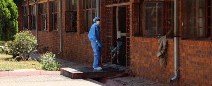 Forensic investigators comb the scene at the Khutlo-Tharo Secondary School in Sebokeng where a fire broke out in the early hours of 15 January 2020. Picture: Ahmed Kajee/EWN