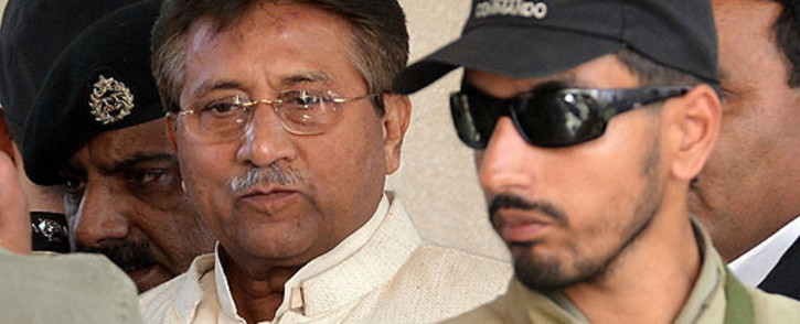 FILE: Former Pakistani President Pervez Musharraf being escorted by authorities. Picture: AFP