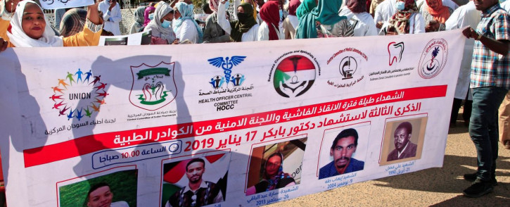 Dozens of Sudanese doctors and medical teams demonstrate in Khartoum on January 16, 2022 to denounce attacks by security forces against medical personnel and doctors during pro-democracy rallies opposed to the October military coup.  Picture: AFP