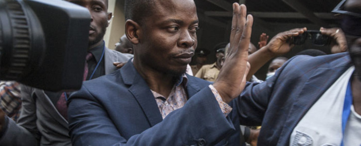 Malawian preacher Shepherd Bushiri waves at supporters as he leaves the Lilongwe Magistrates Court on 19 November 2020, after skipping bail in South Africa and being arrested in Malawi. Picture: AFP