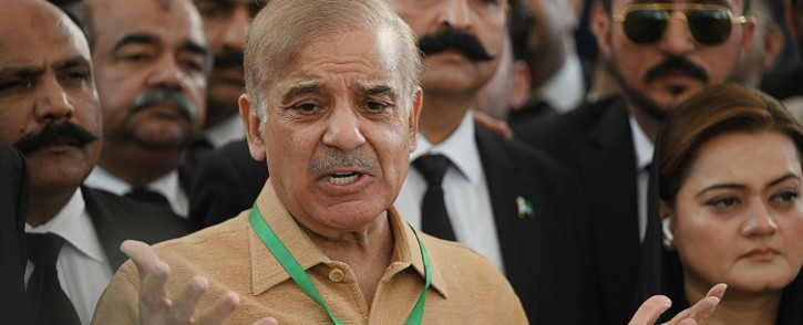 Pakistan's opposition leader Shehbaz Sharif (C) speaks with the media before attending a hearing outside the Supreme Court building in Islamabad on 7 April 2022. Picture: Aamir Qureshi/AFP