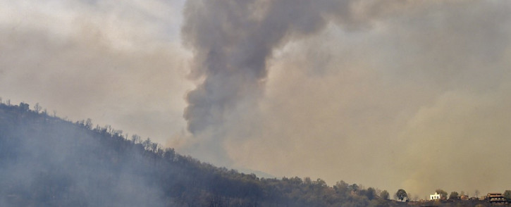 Smoke billows from a wildfire in the forested hills of the Kabylie region, east of the capital Algiers, on 10 August 2021. Picture: Ryad Kramdi/AFP