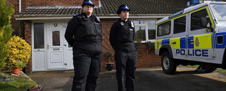 British police community support officers stand on duty outside a residential property in Salisbury, southern England, on 6 March 2018. Picture: AFP
