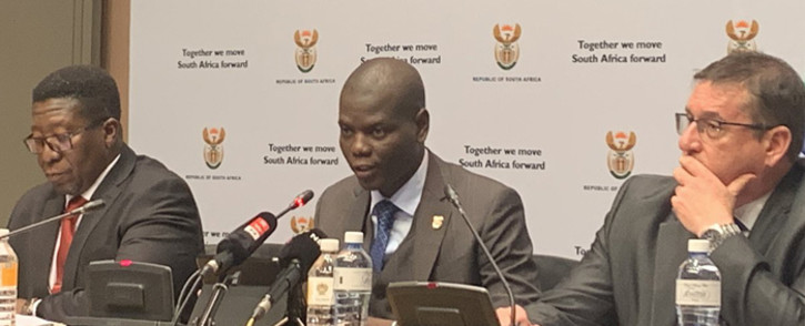 Justice and Correctional Services Minister Ronald Lamola (centre) briefing the media on 17 July 2019 ahead of tabling his department’s budget. Picture: @SAgovnews/Twitter.