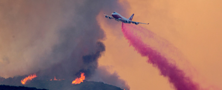 A 747 Global Supertanker jet drops fire retardant at the Holy Fire near Lake Elsinore, in Orange County, California, on 7 August 2018. Picture: AFP.