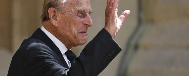 FILE: Britain's Prince Philip, Duke of Edinburgh waves as he takes part in the transfer of the Colonel-in-Chief of The Rifles at Windsor castle in Windsor on 22 July 2020. Picture: Adrian DENNIS/POOL/AFP
