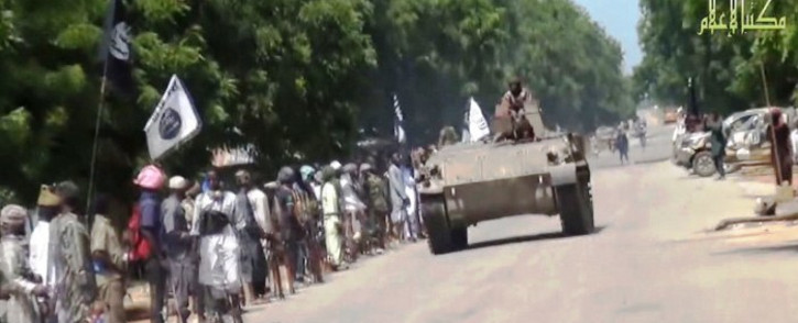 FILE. A screengrab taken on November 9, 2014 shows Boko Haram fighters parading on a tank in an unidentified town. Picture: AFP.