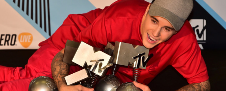 Canadian singer Justin Bieber poses with his trophies in the photo room of the 2015 MTV Europe Music Awards (EMA) at Mediolanum Forum on 25 October, 2015 in Milan. Picture: AFP. 