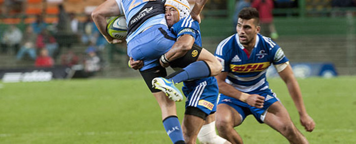 The Stormers's Cheslin Kolbe (C) tackles the Western Force's Patrick Dellit (L) during the Super Rugby 15 match between Western Force and the Stormers at the Newlands Stadium on 17 May 2014, in Cape Town. Picture: AFP/ RODGER BOSCH
