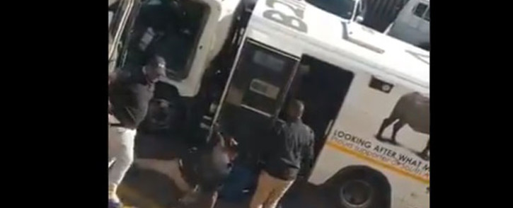 A screengrab shows the suspects attack SBV guards during a cash heist in Laudium.