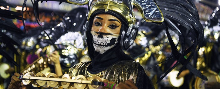 FILE: Members of the Mangueira samba school perform during the first night of Rio's carnival parade at the Sambadrome in Rio de Janeiro, Brazil on 23 February 2020. Picture: AFP