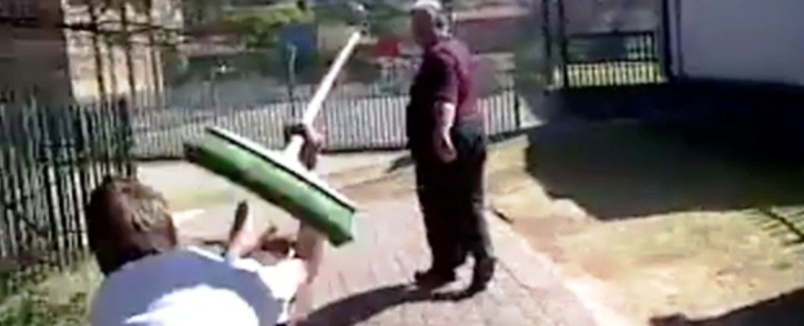 Screenshot from a viral cell phone video shows a grade 8 Glenvista High School student attacking his teacher with a broom on 18 September 2013. It was sent to EWN by a concerned parent and was filmed by another student.