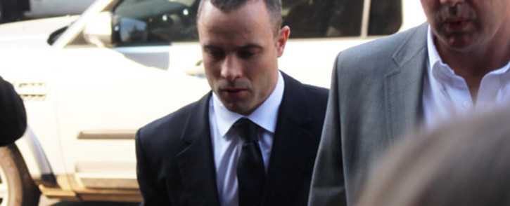 Oscar Pistorius enters the High Court in Pretoria ahead of his murder trial on 8 May 2014. Picture: Christa Eybers/EWN.