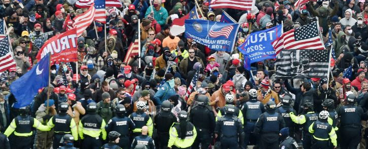 FILE: Trump supporters clash with police and security forces as they storm the US Capitol in Washington, DC on 6 January 2021. Donald Trump's supporters stormed a session of Congress held to certify Joe Biden's election win. Picture: AFP