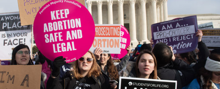  In this file photo taken on 18 January 2019, pro-choice activists hold signs alongside anti-abortion activists participating in the "March for Life," an annual event to mark the anniversary of the 1973 Supreme Court case Roe v Wade, which legalized abortion in the US, outside the US Supreme Court in Washington, DC. Picture: AFP