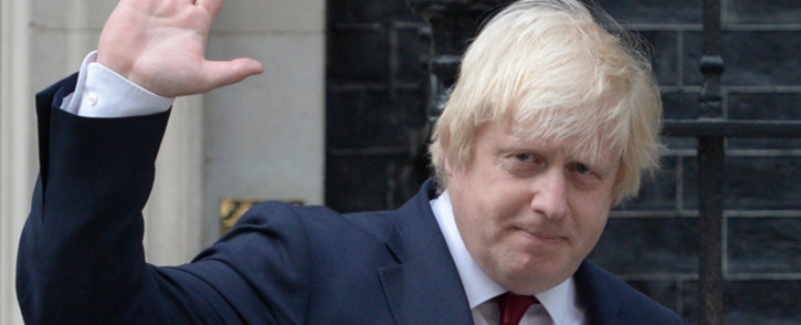 FILE: Boris Johnson waves as he leaves 10 Downing Street in central London after British Prime Minister Theresa May took office. Picture: AFP.