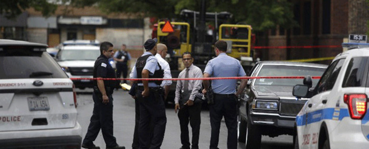 Chicago police officers and detectives investigate a shooting where multiple people were shot on Sunday, August 5, 2018 in Chicago, Illinois. Picture: AFP