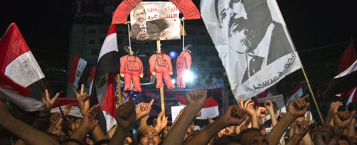 John Kerry will visit Egypt a day before deposed President Mohamed Mursi goes on trial. Picture: AFP 