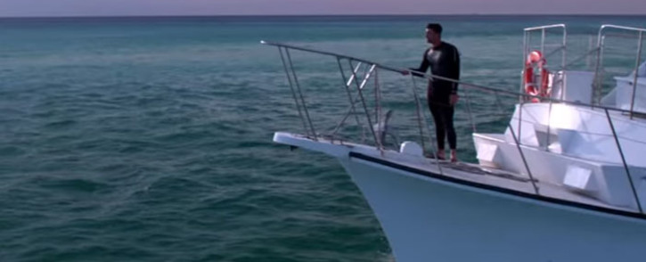 A screengrab of Michael Phelps about to race a great white shark.