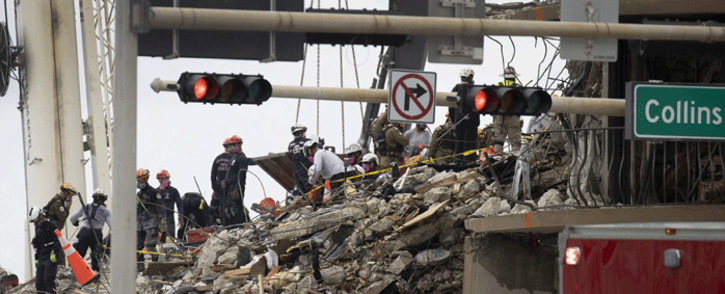 Search and Rescue teams look for possible survivors and to recover remains in the partially collapsed 12-story Champlain Towers South condo building on 29 June 2021 in Surfside, Florida. Picture: Joe Raedle/Getty Images/AFP