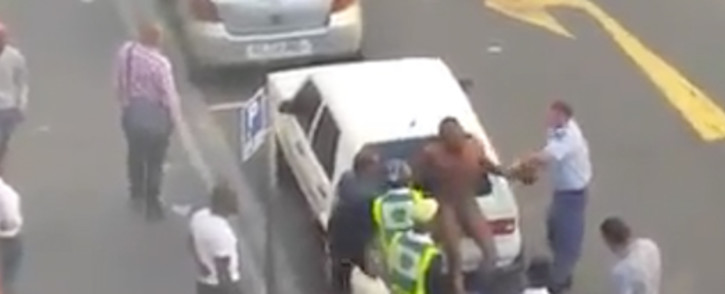 FILE: Gerrit Januarie was one of two police officers caught on video beating the foreign national in March this year. Picture: Screengrab.