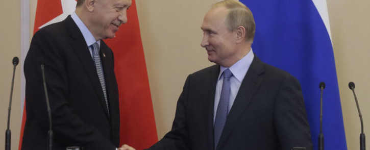 Turkey President Recep Tayyip Erdogan (left) and Russian President Vladimir Putin shake hands during a joint press conference following their talks in the Black Sea resort of Sochi on 22 October 2019. Picture: AFP