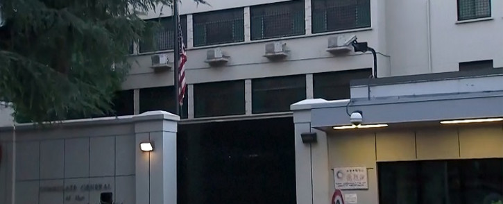 This screengrab from video taken and released by China's state broadcaster CCTV on 27 July 2020 shows the US flag (centre L) being lowered at the United States Consulate in Chengdu in southwestern Sichuan province. Chinese authorities took over the US consulate in Chengdu on 27 July, the foreign ministry said, days after Beijing ordered it to close in retaliation for the shuttering of its consulate in Houston. Picture: AFP.
