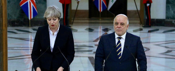 A picture released by the Iraqi Prime Minister's office on 29 November, 2017 show Prime Minister Haider al-Abadi (R) delivering a press statement with British Prime Minister Theresa May in Baghdad. Picture: AFP.