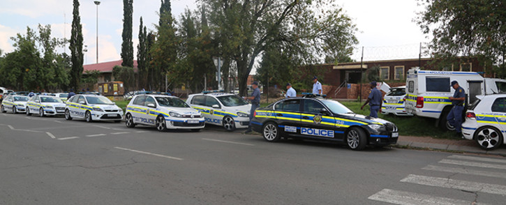 Police gathered at the Katlehong police station following looting of multiple businesses on Saturday 12 March 2016. Picture Kgothatso Mogale/EWN 