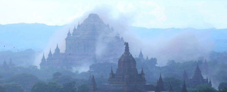 The ancient Sulamuni temple is seen shrouded in dust as a 6.8 magnitude earthquake hit Bagan on August 24, 2016. A powerful 6.8 magnitude earthquake struck central Myanmar on August 24, killing at least one person and damaging pagodas in the ancient city of Bagan, officials said. The quake, which the US Geological Survey said hit at a depth of 84 kilometres (52 miles), was also felt across neighbouring Thailand, India and Bangladesh, sending panicked residents rushing onto the streets. Picture: AFP.