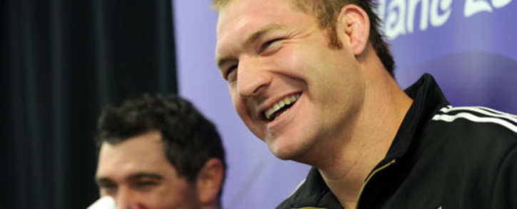 FIEL: Former New Zealand All Black lock Ali Williams (R) speaks at a press conference. Picture: AFP