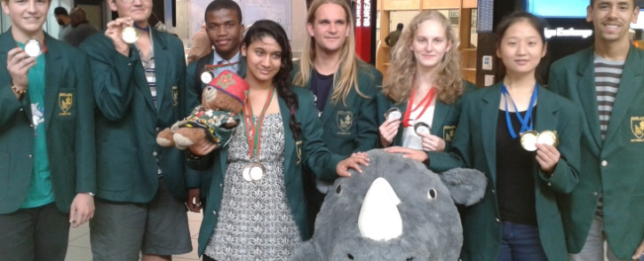From Left: Timothy Schlesinger, Ralph McDougall, Mpho Nkwana, Dylan Nelson (Deputy Leader), Hannah Clayton,SangEun Lee,Liam Baker (Team Leader)Front- Rauseenah Upadhey with the SA Maths Foundation mascot.Picture: Supplied