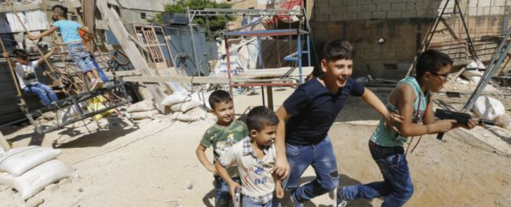 Palestinian and Syrian children play on a street in the Shatila Palestinian refugee camp, on the southern outskirts of the Lebanese capital Beirut, in 2016. Picture: AFP.
