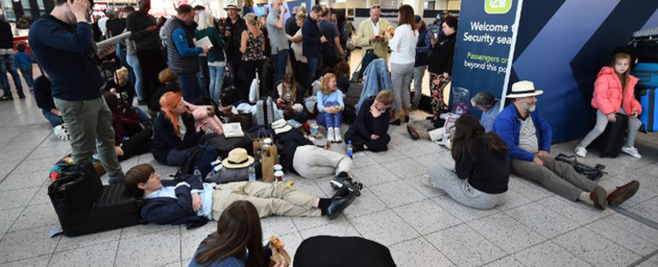 Passengers wait at the North Terminal at London Gatwick Airport, south of London, on 20 December 2018 after all flights were grounded due to drones flying over the airfield. London Gatwick Airport was forced to suspend all flights on December 20 due to drones flying over the airfield, causing misery for tens of thousands of stuck passengers just days before Christmas. Picture: AFP.