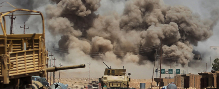 Smoke billows as Iraqi forces advance towards Al-Ayadieh village, the last remaining active front line near Tal Afar, during an operation to retake the city from the Islamic State (IS) group on August 29, 2017. Picture: AFP.