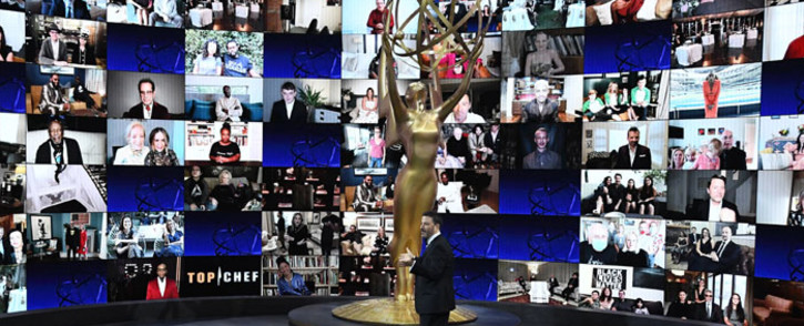 This handout picture released courtesy of Image Group LA/ American Broadcasting Companies, Inc./ ABC shows shows host Jimmy Kimmel in front of a wall of nominees watching remotely at the Staples Center during the 72nd Primetime Emmy Awards ceremony held virtually on 20 September 2020. Picture: AFP