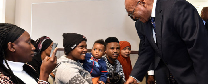 President Jacob Zuma greets refugees during his tour of the Desmond Tutu Refugee Reception Centre. Picture: GCIS