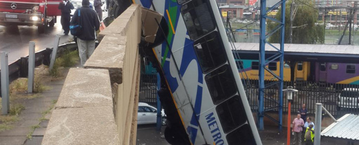 FILE: A Metrobus crashed through the concrete barrier of a bridge in Braamfontein on 25 February 2015. Picture: @MatheGift via Twitter.