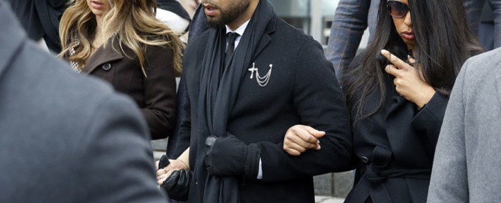 Flanked by attorneys and supporters, actor Jussie Smollett walks out of the Leighton Criminal Courthouse after pleading not guilty to a new indictment on 24 February 2020 in Chicago, Illinois. Picture: AFP